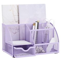 a purple desk organizer with pens and scissors