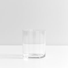 a clear glass sitting on top of a white table