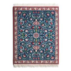 a blue and red rug with an intricate design on the bottom, surrounded by flowers