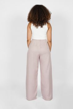 Silky, silky, sly - that’s how we feel in these waist-nipping wide leg pants. Made with a smooth lyocell fabric that glides across the skin and deep, hidden inseam pockets that don’t puff. - Model is 5'3" with 2" heels. She measures 39.5" at the hip, and is wearing a size S - Roomy silhouette through the hips and thighs- Waist-nipping ultra high rise- Deep, hidden inseam pockets- 100% lyocell- Machine wash warm, line dry Fit This pant falls loosely at hips and thighs. If you are in between sizes Lyocell Fabric, Curvy Hips, Business Pants, Wool Vest, Brown Girl, Elegant Chic, Wide Leg Pant, New Launch, Sustainable Fabrics