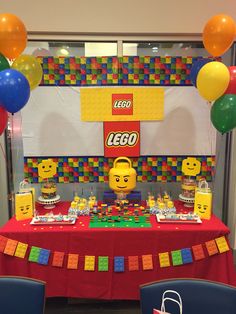 a lego themed birthday party with balloons and decorations