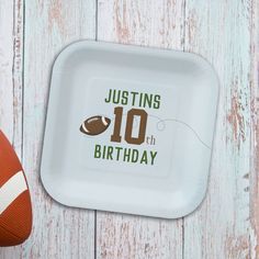 a paper plate with an image of a football and the words, justing 10 th birthday on it