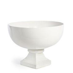 a white bowl sitting on top of a table