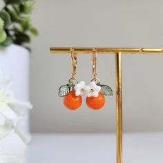 Orange earrings Orange Adjustable Dangle Flower Earrings, Cute Nickel-free Orange Jewelry, Handmade Orange Dangle Flower Earrings, Cute Orange Dangle Jewelry, Orange Drop Earrings For Gift, Orange Earring Jewelry Gift, Orange Dangle Flower Earrings With Ear Wire, Orange Dangle Flower Earrings For Gift, Orange Dangle Flower Earrings Gift