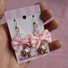 These adorable dangle earrings have a fabric bow, metal charm and acrylic beads The image with the mesuringtool is in cm. The earrings are made with stainless steel hooks.   I also offer these earrings with a clip on option, if you prefer a clip on earrings please add a note with your order stating you would prefer clip ons instead of hooks. Shipping Information: All our order are shipped within 2 weeks after ordering and are shipped with track and trace.  Please keep in mind that these jewelry