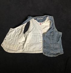 "Vintage Women's Retro Denim Vest/ Blue Jeans tan / Metal buttons with label: BIAGGINI/ Biaggini/ Bolero vest/ Pockets. Seams inside with flower pattern. Condition: good. Measurements: Length: 19.7\" / 50 cm Pit to pit: 20.1\" / 51 cm Labeled size: EU 44 (plus size XL) Material: 99% cotton, 1% elastane Please check measurements to insure a proper fit. Remember to allow yourself some extra room for movement. You can compare these with something from your closet that fits you well. #JZ13" Casual Cotton Vest With Snap Buttons, Medium Wash Sleeveless Vest With Button Closure, Sleeveless Medium Wash Vest With Button Closure, Casual Denim Blue Vest With Buttons, Sleeveless Vest With Button Closure In Medium Wash, Denim Blue Sleeveless Vest With Pockets, Sleeveless Cotton Vest With Snap Buttons, Cotton Sleeveless Vest With Snap Buttons, Medium Wash Cotton Vest With Pockets