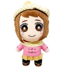 a small stuffed doll with big eyes and brown hair