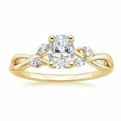 a yellow gold engagement ring with an oval cut diamond