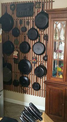 pots and pans are hanging on the wall