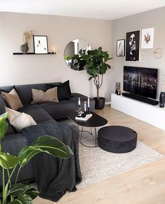 a living room filled with furniture and a flat screen tv