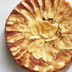 an apple pie is shown on a white surface