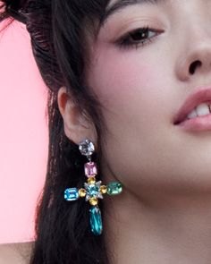 a close up of a person wearing earrings