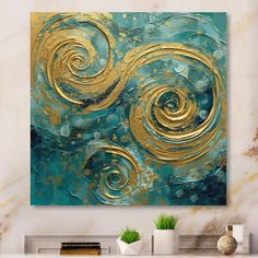 an abstract painting with gold swirls on a blue and green background in a living room