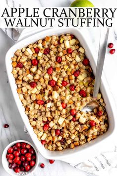 an apple cranberry walnut stuffing in a white casserole dish