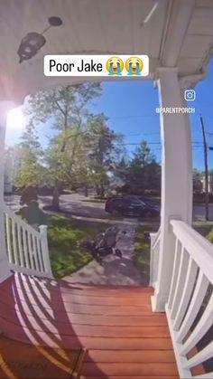 an image of a porch with the sun shining on it's back deck and trees in the background