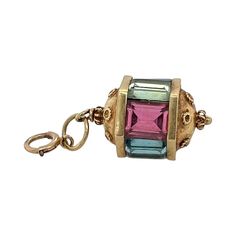 This is part of Chairish’s Fine Jewelry assortment.  This is a fun vintage 14K gold charm or pendant in the Victorian style. The gold tests 14k and the jump ring is also marked. The top and bottom have Etruscan beadwork. There are alternating faceted rectangular glass of pastel colors. Condition is excellent.  Dimensions: Height: 20mm; Width: 11mm; Weight: 4.7 grams Jewelry Style, Travel Goals, Victorian Style, Gold Charm, Victorian Fashion, Beautiful Things, Pastel Colors, Bead Work, Brooches