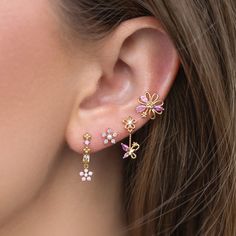 Delicate pink florals paired with fluttering butterflies add a touch of magic to your everyday look. You'll get lost in the stunning and calming baby pink hues of the cubic zirconia stones. Light Pink Jewelry Set, Whimsical Pink Earrings With Flower Charm, Elegant Pink Cubic Zirconia Flower Earrings, Dainty Pink Flower Earrings, Delicate Pink Flower Earrings For Spring, Dainty Pink Flower-shaped Earrings, Elegant Pink Jewelry With 3d Flowers, Pink Cubic Zirconia Flower-shaped Earrings, Pink Cubic Zirconia Flower Shaped Earrings