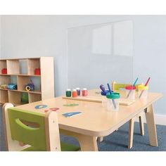 a child's table and chairs in a room