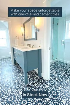 a bathroom with blue and white tile flooring