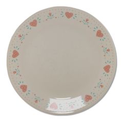 a white plate with hearts and flowers painted on the rim, against a white background