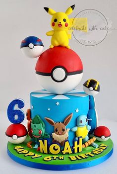 a pokemon birthday cake with pikachu and other characters on it's top