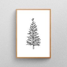 a black and white drawing of a pine tree on a gray wall with a wooden frame