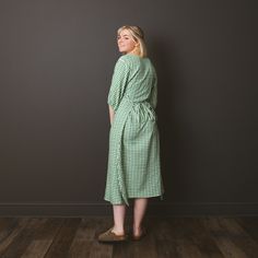 "Save time shopping for your new favorite clothing pieces, here at Stitched By Sophia we've got you covered! Each piece is meticulously made by hand, and we guarantee you will love it! These gingham dresses are sustainably made by hand using cotton viscose fabric. The ties on this dress create an adjustable size, so one dress can fit anyone! This dress is available in sizes small/medium, and large/extra large.  Size small/medium fits measurements up to: Bust-37\" Waist-30\" Hip-39\" Size large/extra large fits measurements up to: Bust-45\" Waist-38\" Hip-47\" There is limited stock of this item. Some features include: *Cotton viscose fabric *Machine wash and dry-able *Tie closures at front and back, creating an adjustable size *Green and white gingham pattern *FREE shipping" Relaxed Fit Cotton Dress With Tie Waist, Cotton Dress With Tie Waist And Relaxed Fit, Gingham Dresses, Adjustable Dress, Elastic Sleeves, Mid Length Dress, Cold Spring, Clothing Pieces, Gingham Pattern