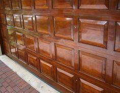 a close up of a wooden garage door