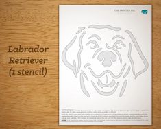 a dog's face is drawn on a sheet of paper with the words labrador retriever stencil