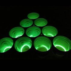 green cups are lit up in the dark