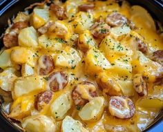 a crock pot filled with potatoes covered in cheese