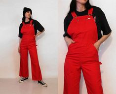 "Vintage '70s cherry red Lee denim overalls. Made of cotton denim. Donut button fly. Adjustable suspender straps. 2 side pockets + 2 back patch pockets. Wide legs with frayed, cut off hems. Smaller size. DETAILS-----> Label: Lee Era: '60s/'70s Fabric: cotton denim MEASUREMENTS-----> Tag size: n/a - no size marked - should suit sizes small - medium Bust: open Waist: 14.5\" - snug 15.5\" Rise: 13.75\" Hips: 18.5\" Inseam: 27\" Shoulder to waist: adjustable with straps Waist to hem: 39.5\" Total le Red Bib Front Overalls With Pockets, Casual Red Cotton Shortalls, Red Cotton Overalls For Spring, Fitted Red Overalls, Vintage Spring Workwear Overalls, Retro Spring Workwear Overalls, Denim Suspenders, Red Overalls, Checked Pants