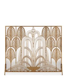 a gold and white art deco fireplace screen