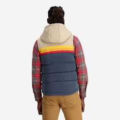 The Epic Fader Puffer Vest is the ultimate fusion of function and fashion. With its vibrant, vintage-inspired exterior and cozy layer of soft micro-flannel on the inside, this retro puffer vest looks as good as it feels. The fill is 100% polyester and the outside fabric is a plush, water-resistant cotton. Additional features are 2 inside pockets and high-quality YKK® Zippers. Get one now and let your retro style shine! Female Model is 5'10" / 130 lbs and is wearing a size XS Male Model is 5'11" Cotton Hooded Puffer Jacket With Double-lined Hood, Cotton Puffer Jacket With Double-lined Hood, Casual Down Puffer Jacket With Double-lined Hood, Casual Down Puffer Jacket With Adjustable Hood, Casual Quilted Hooded Jacket For Outdoor Activities, Casual Cotton Puffer Jacket With Double-lined Hood, Casual Nylon Puffer Jacket With Fleece Lining, Hooded Cotton Puffer Jacket For Cold Weather, Outdoor Cotton Puffer Jacket With Detachable Hood