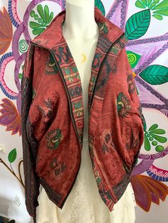 this silk jacket is a one of a kind!✨ hand picked vintage silk from special ethnic places to bring you the most beautiful silky and soft ones we could find 🌞 this jacket is like a piece of art, it has so many details and you will always be the only one to have it. it has a zipper, two front pockets and an inner zipper pocket️ jacket has an inner liar of fleece, so it will keep you cosy and warm in cold winter days. 🌱 you may find some small imperfections on the silk, this should be loved as a reminder of the long journey this silk has gone to create this unique jacket 🌿 it's a one loss free size  and it's unisex  great as a unique one of a kind gift 🎁  wash-30 degrees  thanks  💜 Bohemian Fitted Outerwear For Festivals, Fitted Silk Bohemian Outerwear, Fitted Bohemian Outerwear For Festivals, Bohemian Silk Winter Outerwear, Bohemian Silk Outerwear For Winter, Rat King, Rave Clothing, Unique Jackets, Peacock Pattern