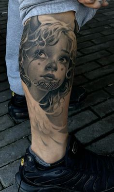 a person with a tattoo on their leg