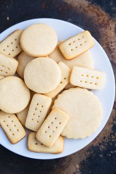 a white plate topped with cut out cookies