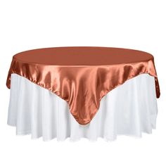 an image of a table with a rose gold satin overlay and white linens