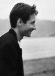 black and white photograph of a man laughing