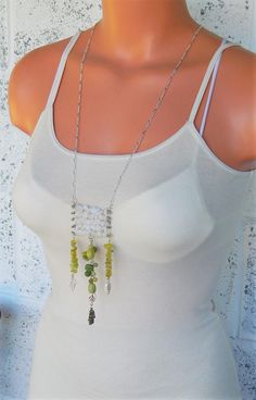 "White quartz necklace - Hamsa necklace - Hand of Fatima - abacus - long leafy statement necklace - hippie necklace - festival style jewelry This particular one of a kind necklace features an abacus of soft white quartz.  It is embellished with green stone beads and nuggets including new jade, green quartz, and olivine, as well as pretty carved howlite leaves. Necklace measures 32 inches. The pendant is 2 inches wide and super long, nearly 6 inches. Secures with a lobster claw style clasp. Neckl Bohemian Long Green Necklace, Green Bohemian Crystal Necklace With Beaded Chain, Green Bohemian Dangle Crystal Necklace, Bohemian Green Crystal Pendant Necklace, Bohemian Green Pendant Crystal Necklace, Convertible Jewelry, Hamsa Necklace Gold, Handmade Crystal Necklace, Leaves Necklace