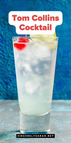 a tall glass filled with ice and topped with a red cherry on the rim next to a sign that says tom collins's cocktail