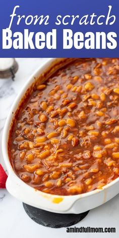 baked beans in a white casserole dish with text overlay that reads from scratch baked beans