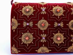 "Burgundy velvet clutch bag, zardozi evening bag, embroidered with copper medallions and embellished with genuine semi precious stones, to give an opulent, multidimensional dazzling effect. This is a gorgeous wardrobe investment piece! A classic design that will never go out of style! A modern heirloom to be cherished! Add instant glamour and elegance to any ensemble! Perfect for any evening occasion, be it wedding, gala, cocktail party. The word Zardozi means \"gold thread\". It is an elaborate Red Wedding Clutch With Handwork, Traditional Red Embellished Clutch, Rectangular Red Clutch With Handwork, Traditional Embroidered Velvet Clutch, Elegant Red Beaded Clutch, Velvet Clutch Bag, Embellished Purses, Beaded Clutch Bag, Velvet Clutch