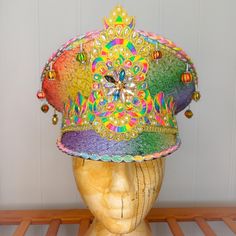 A stunning rainbow sequinned festival hat with rainbow and golden trim and embellishments which will really ensure you stand out from the crowd. The hat is a size medium/57cm but can be made to fit smaller sizes by adding padding to the inside band. At the back, there is a band of elastic which secures the hat and makes it comfortable to wear.  This piece would be a fantastic addition to your festival wardrobe or fancy dress costume. If you are unsure of sizing or have any questions, please drop Fancy Dress Costume, Festival Hat, Dress Costume, Costume Hats, Fancy Dress Costumes, Festival Outfit, Colour Palette, Fancy Dress, Costume Accessories