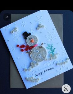 a christmas card with a snowman on it