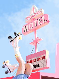 a pink motel sign with a horse on top