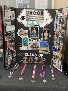 a table topped with pictures and medals