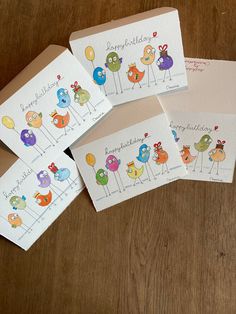 four cards with birds and balloons on them