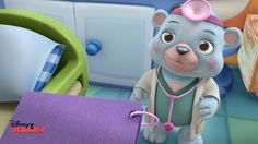 a cartoon bear with a stethoscope standing next to a purple folder on a table