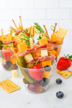 fruit and cheese appetizers in plastic cups with crackers